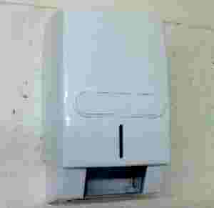 Bulk Toilet Tissue Dispenser. Holds Three Packs.